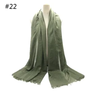 Olive green cotton linen tassel scarf detail shot, breathable solid color shawl.