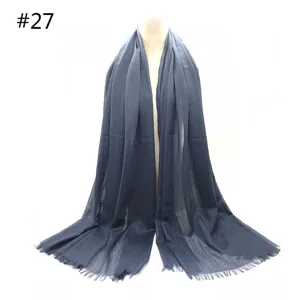 Dark blue cotton blend scarf detail, soft breathable fabric with short fringe design.