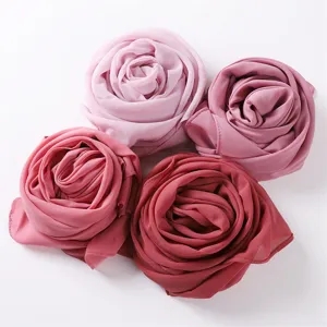 Close-up detail of soft pearl chiffon headscarf rolled in rose shape, elegant solid color hijab.