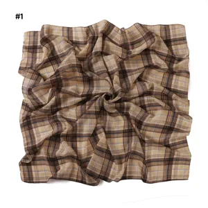 Detailed view of retro brown plaid chiffon square scarf fabric texture and elegant lines pattern.