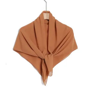 Detailed view of the solid color chiffon square scarf, lightweight and breathable material.