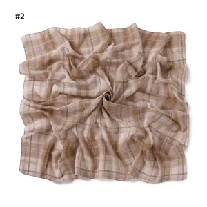 Close-up view of vintage plaid chiffon square scarf, showing soft texture and elegant drape.