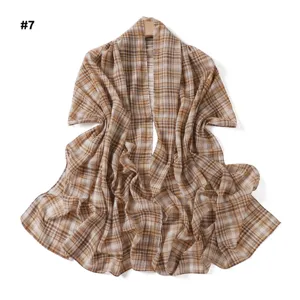 Detailed view of the elegant brown plaid chiffon shawl, showing soft texture and draped style.