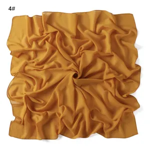 Solid color chiffon square scarf detail shot, lightweight breathable summer sun protection wrap.