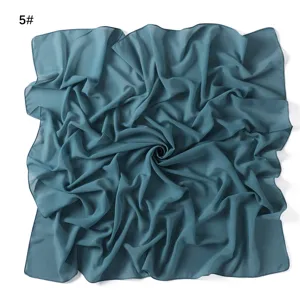 Solid color dark teal chiffon square scarf detail, lightweight breathable fabric texture.