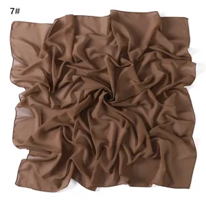 Detailed view of the brown chiffon square scarf showing lightweight fabric texture and soft drape.