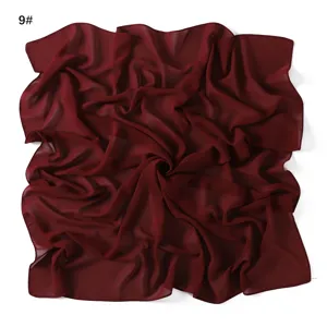 Dark red chiffon square scarf detail view, lightweight breathable fabric texture.