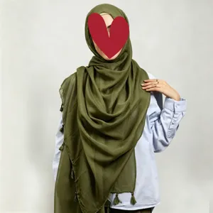 Solid color cotton linen long hijab scarf with tassels in olive green for women, main view.