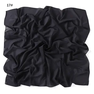 Detailed view of the lightweight black solid color chiffon square scarf, soft and breathable.