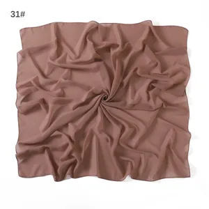 Detail view of a solid color chiffon square scarf, lightweight and breathable fabric.