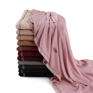 Detailed view of elastic mercerized cotton rhinestone long scarf in multi colors.