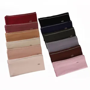 Detailed view of elastic mercerized cotton rhinestone long headscarf in multi colors.