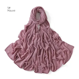 Detailed view of the crinkled stretch jersey hijab in mauve, showing delicate pleats and texture.