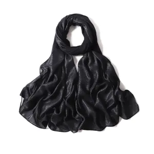 Detailed view of the black sparkly chiffon long scarf texture, lightweight and elegant fabric.