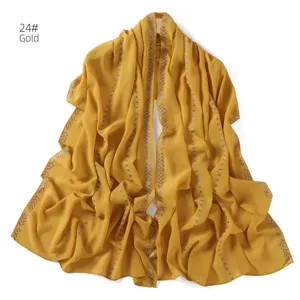 Gold chiffon hijab scarf with rhinestone chain details, elegant long wrap shawl for women.