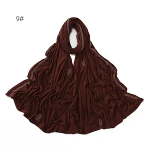 Detailed view of the dark brown mercerized cotton long hijab scarf with shiny rhinestones.