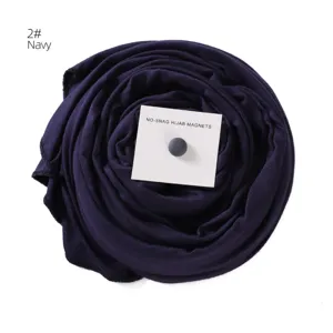 Detailed close-up view of the navy mercerized cotton hijab scarf featuring a strong magnetic pin.