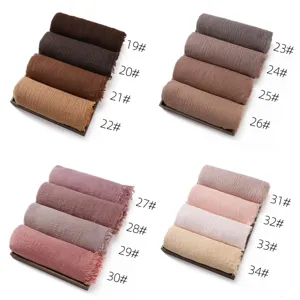 Solid color breathable cotton linen hijab scarf shawl for women with elegant tassel edge.
