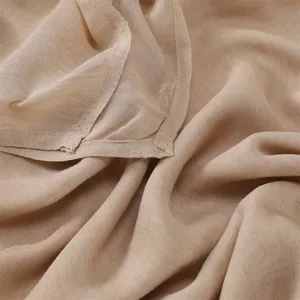 Close-up detail of lightweight solid color breathable modal cotton scarf fabric hem