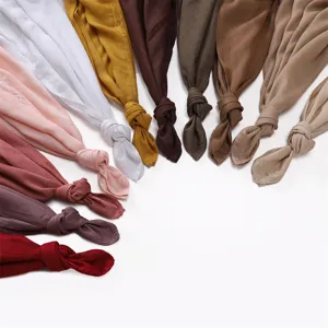 Detailed view of lightweight modal solid color headscarf shawls displayed in multiple colors.
