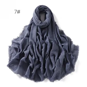 Solid color cotton linen scarf with frayed edges, soft breathable shawl for women daily wear.