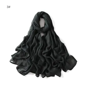 Details of the solid black modal breathable shawl scarf, showing lightweight texture and drape.