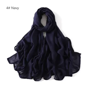 Detailed close-up of a dark blue modal soft breathable solid color scarf shawl fabric.