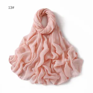 Detail shot of the soft pink modal cotton solid scarf, showing fine breathable fabric texture clearly.