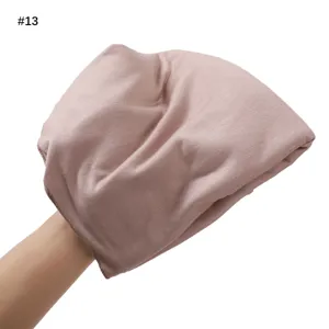 Soft modal jersey headscarf detail view, breathable dusty pink hijab fabric closeup.