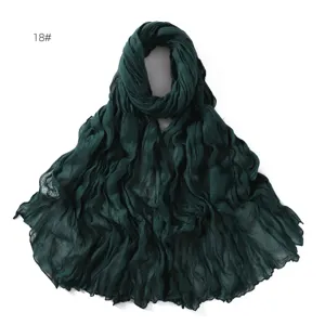 Solid color crinkle cotton linen breathable thin scarf for women, elegant dark green wrap.