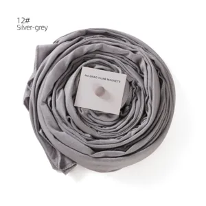 Silver-grey hijab scarf with strong magnetic clasp, premium mercerized cotton fabric detail.