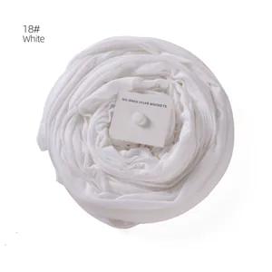 Mercerized cotton hijab scarf with magnetic buckle in white color, detailed view of fabric.