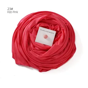 Oversized mercerized cotton long hijab scarf with strong magnetic clasp in hot pink color detail.