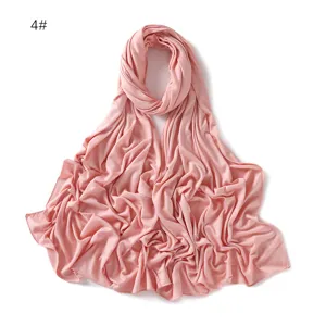 Modal jersey hijab scarf detail view, soft pink plain solid color long shawl fabric.