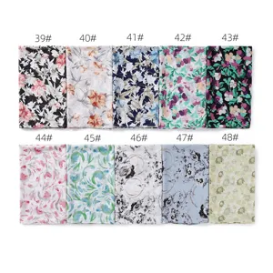Floral print chiffon scarf fabric detail showing multiple colorful floral pattern options clearly.