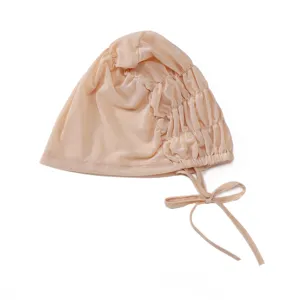Breathable mesh inner hijab cap with adjustable ties and elastic shirring for comfortable daily wear.
