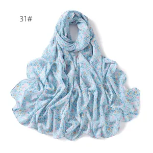 Blue floral print chiffon scarf detail view, elegant lightweight sun protection shawl.