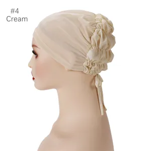 Cream breathable mesh under cap with tie and elastic back, perfect for comfortable hijab wear.