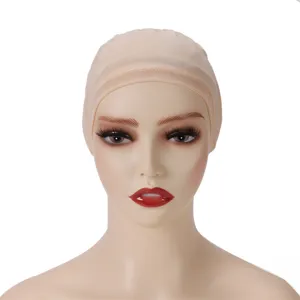 Close-up detail of beige mesh wig cap showing breathable elastic material and fine texture.