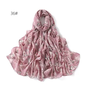 Floral chiffon scarf detail, lightweight fabric with cute print for summer sun protection.