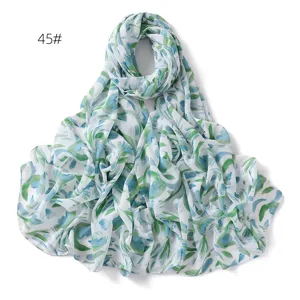 Detailed view of the blue and green watercolor floral print chiffon scarf fabric texture.