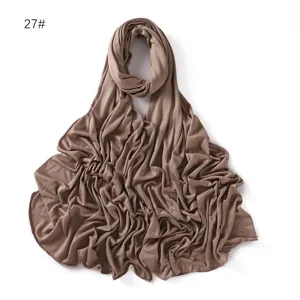 Detailed view of the solid color modal jersey hijab scarf in brown, soft fabric texture.