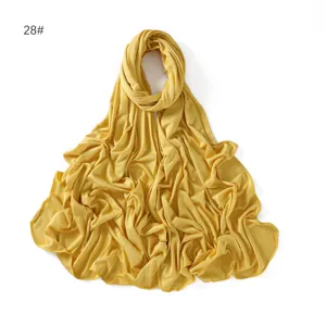 Yellow modal long scarf detail view, elegant solid color jersey hijab for everyday wear.