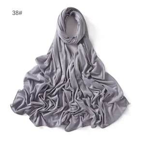Solid color modal jersey hijab scarf detail view, showing soft fabric texture and graceful drape.