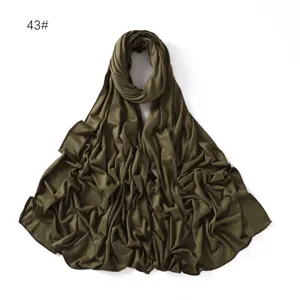 Detail shot of solid color modal jersey hijab scarf, soft drape fabric closeup view.