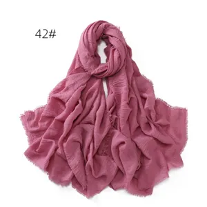 Solid color crinkled cotton linen scarf shawl with fringe edges for women daily wear.