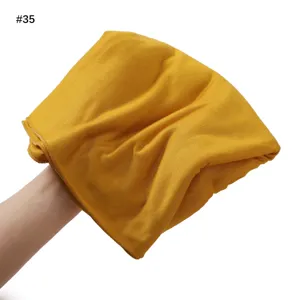 Detail view of the soft solid color jersey modal scarf, showing breathable fabric texture.