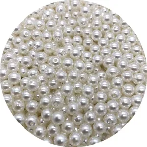 Detail view of white ABS imitation pearl loose beads with straight holes for DIY jewelry crafting.