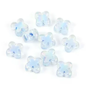 Close up of iridescent blue acrylic four leaf clover beads, perfect for DIY jewelry crafting.