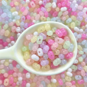 Close-up detail of colorful acrylic jelly peanut beads, perfect for DIY handmade jewelry crafting.